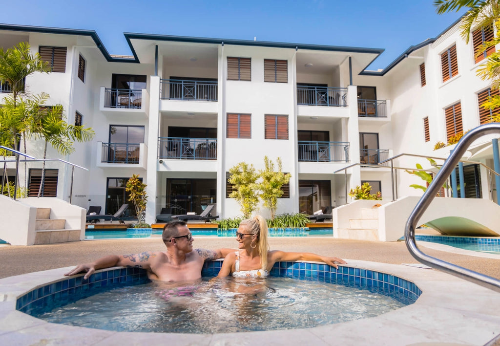 Couple in a hot tub enjoying a holiday accommodation package at Meridian Resort Port Douglas 